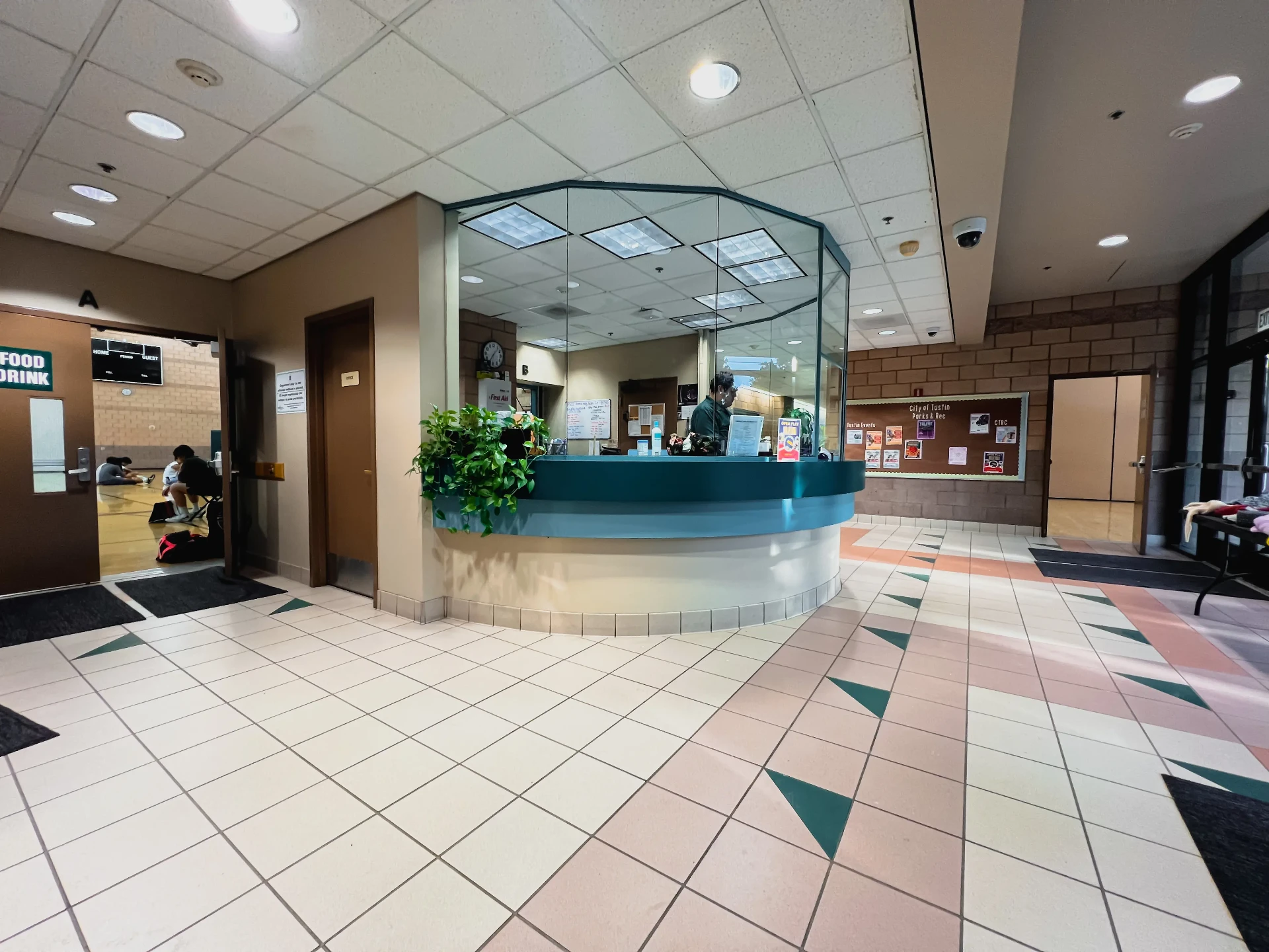 Civic center lobby interior featuring curved reception desk designed by Entero Architects
